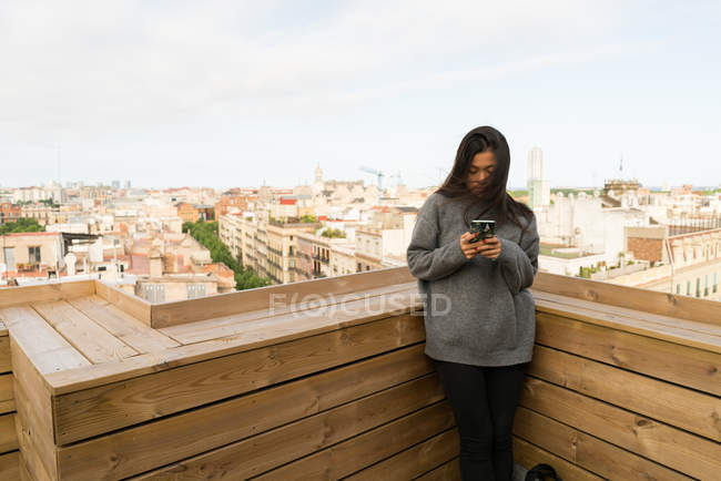 Long Hair Chinese woman checking her phone — Stock Photo