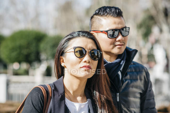 Asian Chinese honeymooners tourist walking around la almudena ana palacio real in Madrid, Spain — Stock Photo