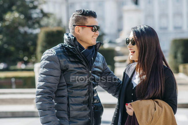 Chinese tourist walking around la almudena ana palacio real in Madrid, Spain — Stock Photo