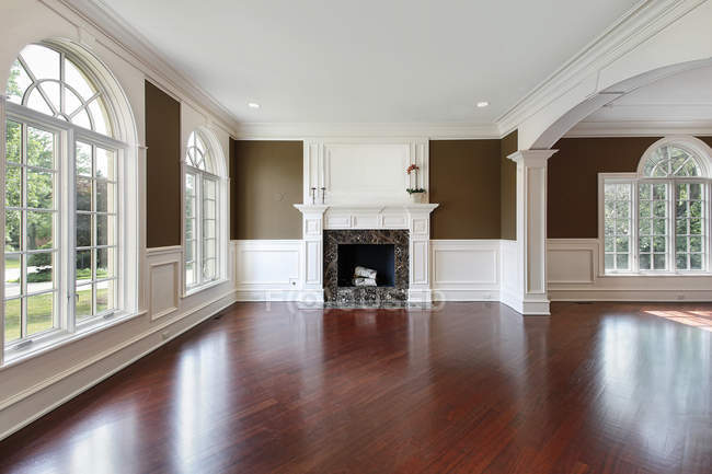 Living room with cherry wood flooring — Stock Photo