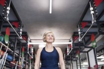 Woman standing in gym — Stock Photo