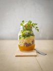 Preserving jar of quinoa salad with vegetables — Stock Photo