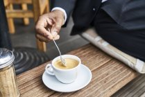 Man sitting in cafe with coffee — Stock Photo