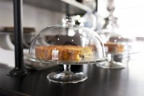 Cake on glass cake stand — Stock Photo