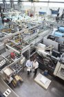 Men examining product in factory — Stock Photo