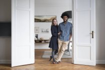 Couple standing in door frame — Stock Photo