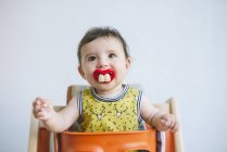 Baby girl sucking pacifier — Stock Photo
