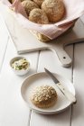 Closeup view of oat rolls with compound butter — Stock Photo
