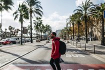 Spain, Barcelona. Portrait of young black guy in casual clothing, enjoying the city and the good weather. — Stock Photo