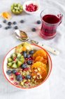 Bowl of oats with fresh fruits — Stock Photo