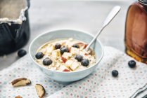 Porridge with blueberries, apples and cinnamon — Stock Photo
