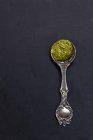 Silver ornate spoon with pesto — Stock Photo