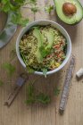 Top view of couscous salad with avocado and spinach — Stock Photo