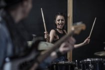 Female rock drummer at recording studio — Stock Photo