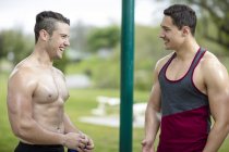 Two young men doing strength training in park — Stock Photo