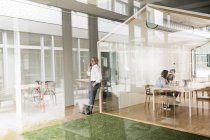 Caucasian business people in modern office — Stock Photo