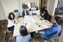 Business people having a team meeting in office — Stock Photo
