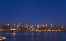 USA, New York City, Midtown Manhattan cityscape at night — Stock Photo