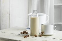 Vegan milk, Hazelnut milk in bottle on table — Stock Photo