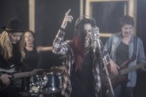 Female rock band in recording studio — Stock Photo