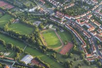 Germany, arial view of Hildesheim town with sports-field — Stock Photo