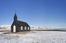Budir black church on snow covered landscape in Iceland — Stock Photo
