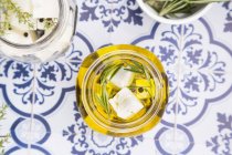 Glass of diced sheep cheese — Stock Photo