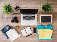 Top view of Different items on desk with gadgets — Stock Photo