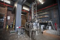 Interior of clean modern distillery with machine — Stock Photo