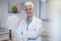 Portrait of confident senior woman in lab — Stock Photo