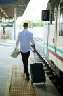 Young man leaving the train — Stock Photo