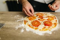 Cropped image of Chef preparing pizza at home — Stock Photo