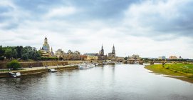 Germany, Saxony, Dresden, historic old town with Elbe River in the foreground — Stock Photo