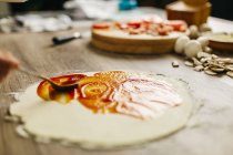 Cropped image of Chef preparing pizza at home — Stock Photo