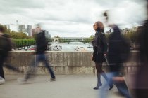France, Paris, people walking on a bridge — Stock Photo