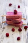 Stack of homemade raspberry ice lollies — Stock Photo