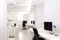 White modern office interior with computers — Stock Photo