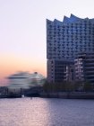 Elbphilharmonie and driving cruise liner at sunset, Hamburg, Germany — Stock Photo