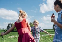 Children playing in meadow — Stock Photo