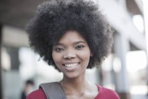 Portrait of smiling African woman outdoors — Stock Photo