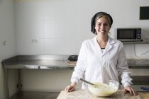 Portrait of a smiling female chocolatier — Stock Photo
