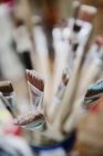 Paint brushes in a studio, close-up — Stock Photo