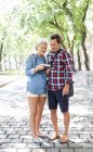 Happy cute senior couple looking on camera together outdoors — Stock Photo