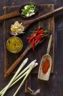 Top view of ingredients for Asian curry paste on wooden board — Stock Photo