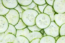 Closeup view of green cucumber slices background — Stock Photo