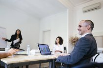 Business people having a team meeting in office — Stock Photo