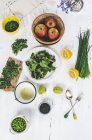 Top view of different salad ingredients on white surface — Stock Photo