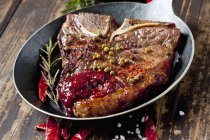 Porterhouse steak with tomato sauce — Stock Photo