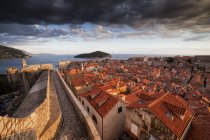 Croatia, Dalmatia, Dubrovnik, Old Town, view from city wall at sunset with moody sky — Stock Photo