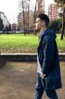 Spain, Gijon, young man walking in the park — Stock Photo